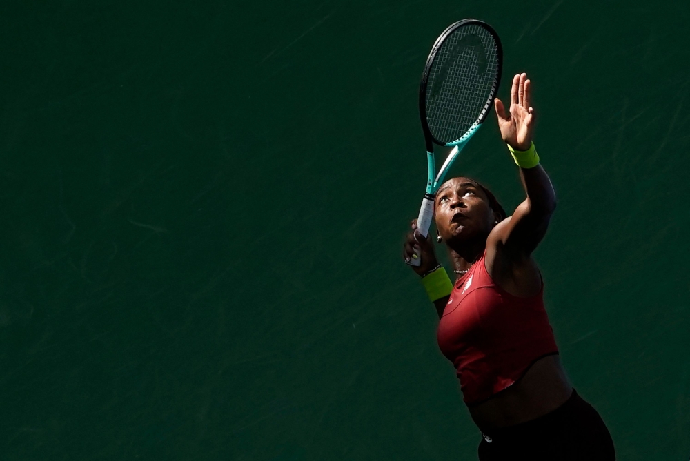 TOPSHOT - USA's Coco Gauff serves to Russia's Mirra Andreeva during the US Open tennis tournament women's singles second round match at the USTA Billie Jean King National Tennis Center in New York City, on August 30, 2023. (Photo by TIMOTHY A. CLARY / AFP)

