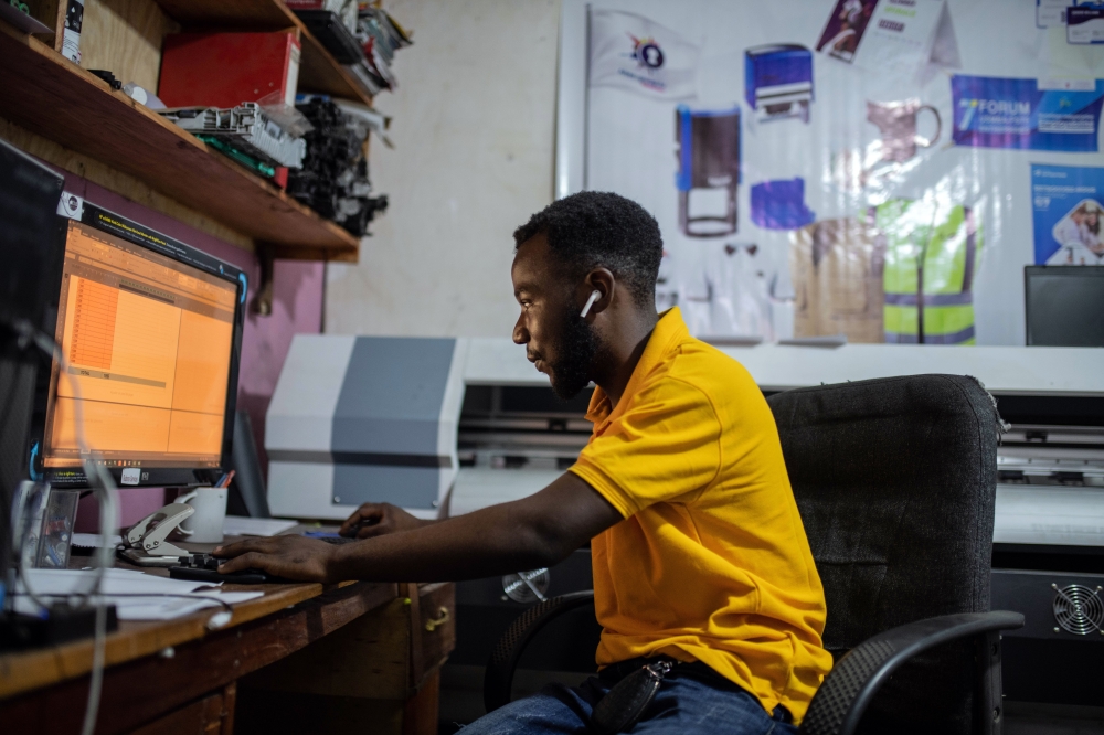 Ezekia Rubona owns a small shop in Goma that previously relied on diesel generators for electricity. (Moses Sawasawa/The New York Times)