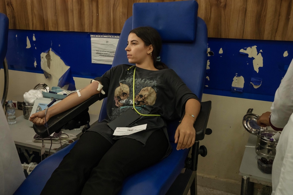 A woman donates her blood for victims of a deadly earthquake, at the Marrakesh Regional Blood Transfusion Center, in Morocco, on Sunday, Sept. 10, 2023. (Nariman El-Mofty/The New York Times)