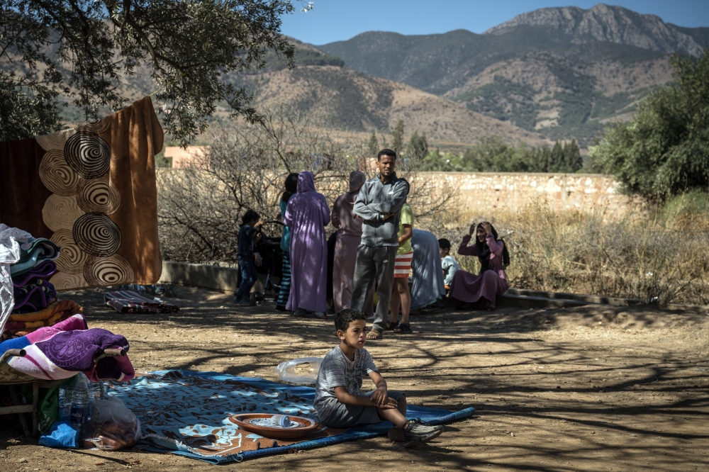 Local residents at an emergency shelter in the village of Amizmiz, Morocco, on Sunday, Sept. 10, 2023.  (Sergey Ponomarev/The New York Times)