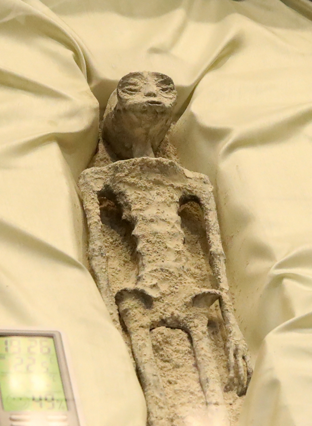 Remains of an allegedly 'non-human' being is seen on display during a briefing on unidentified flying objects, known as UFOs, at the San Lazaro legislative palace