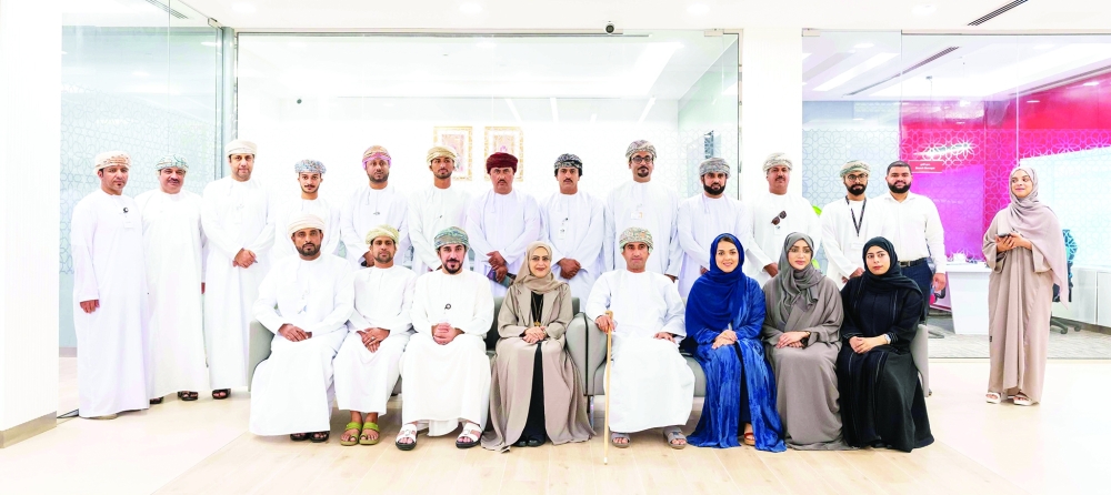 Bank officials and guests pose for a photo during the opening of the new corporate branch.