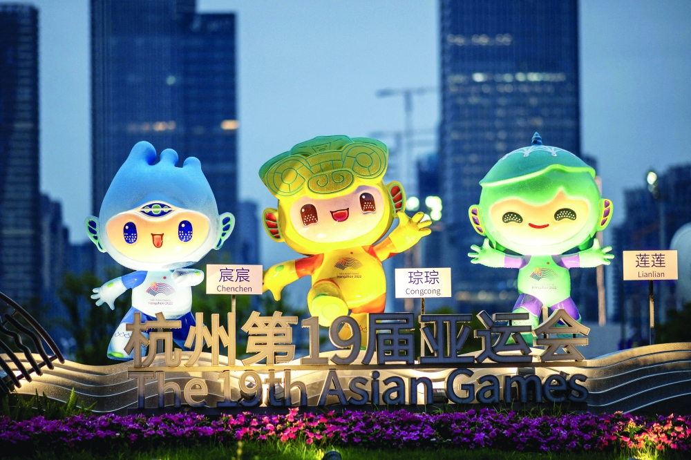 (L to R) The official mascots of the 2022 Asian Games Chenchen, Congcong and Lianlian are pictured in Hangzhou, China's eastern Zhejiang province on September 21, 2023. (Photo by Philip FONG / AFP)

