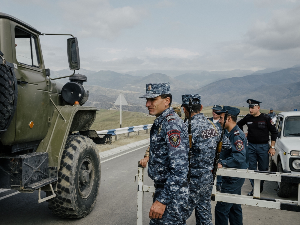 Armenian police at an Armenian border outpost on the road that crosses Azerbaijani territory to the disputed Nagorno-Karabakh enclave, near the village of Kornidzor, Armenia, Sept. 22, 2023. (Nanna Heitmann/The New York Times)
