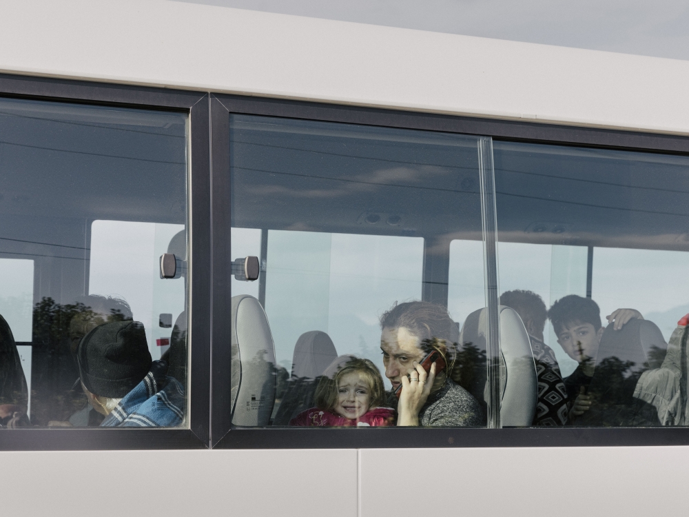 Refugees from Nagorno-Karabakh cross the border into Armenia near Kornidzor, Armenia, on Sunday, Sept. 24, 2023. (Nanna Heitmann/The New York Times)