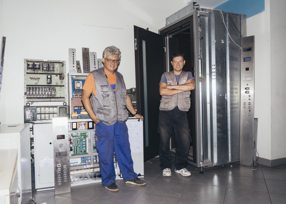 John and Paris Skouros, brothers and owners of the elevator company Skouros & Sons, at their offices in Athens on Sept. 8, 2023. (Marco Arguello/The New York Times)