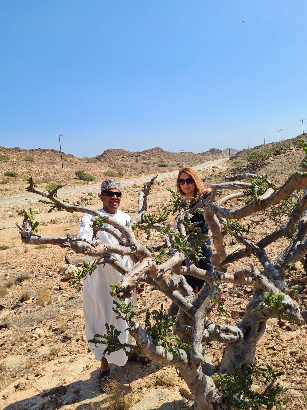 Corrina with Abdullah at Fazaya Beach