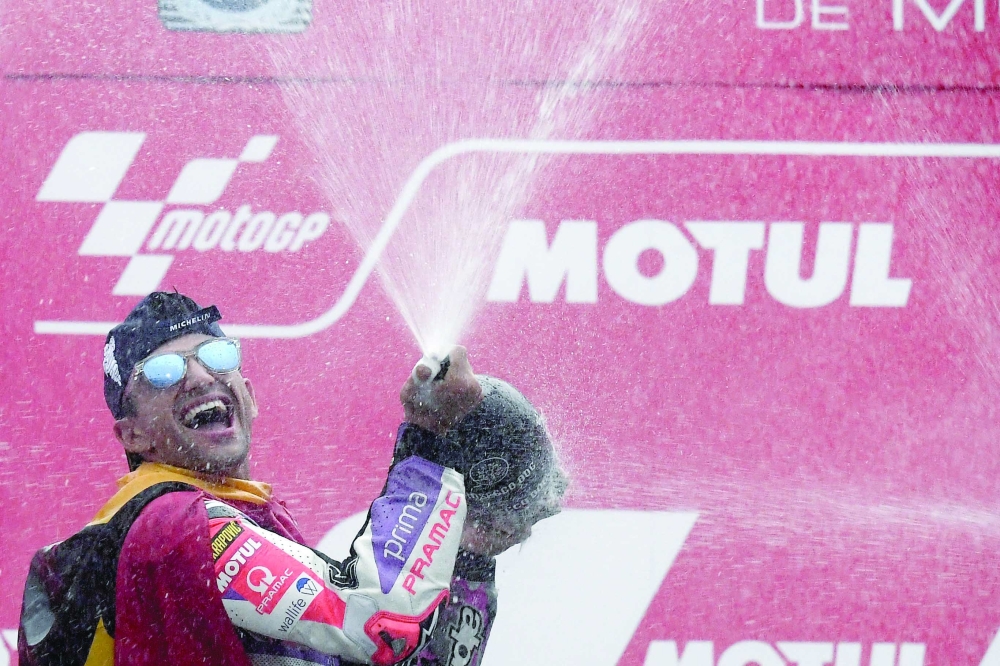 Jorge Martin of Spain celebrates on the podium of the MotoGP Japanese Grand Prix in Motegi. — AFP