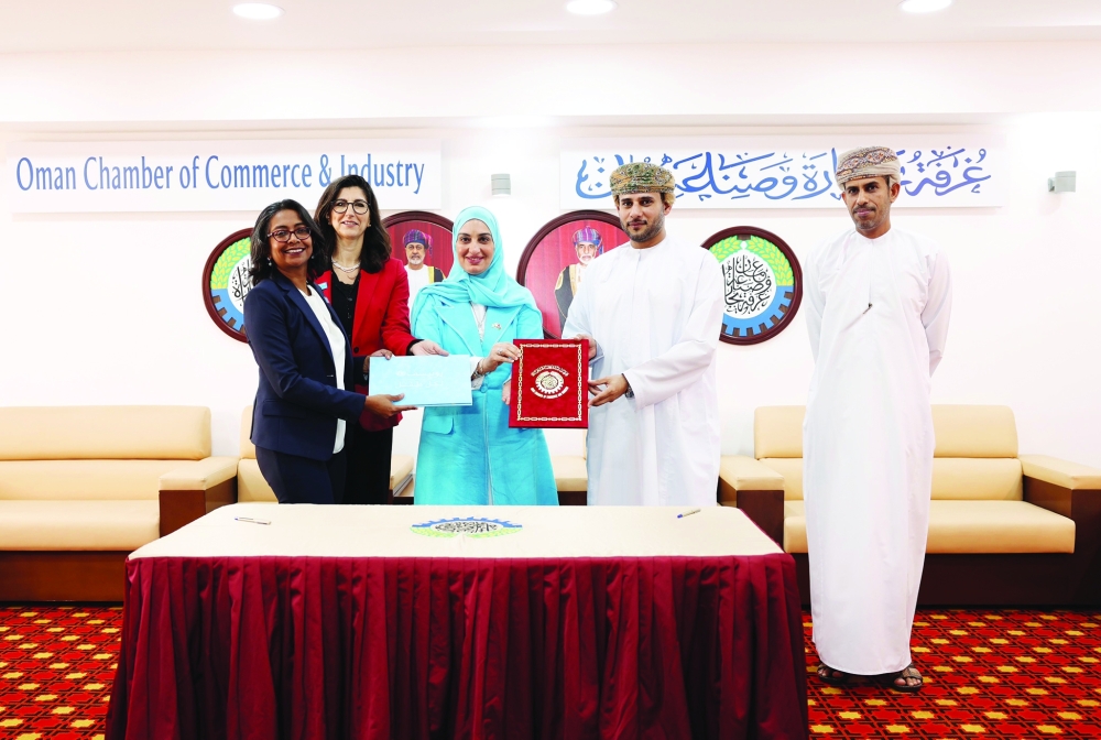 OCCI, Unicef officials pose for a photo after the signing of the MoU.