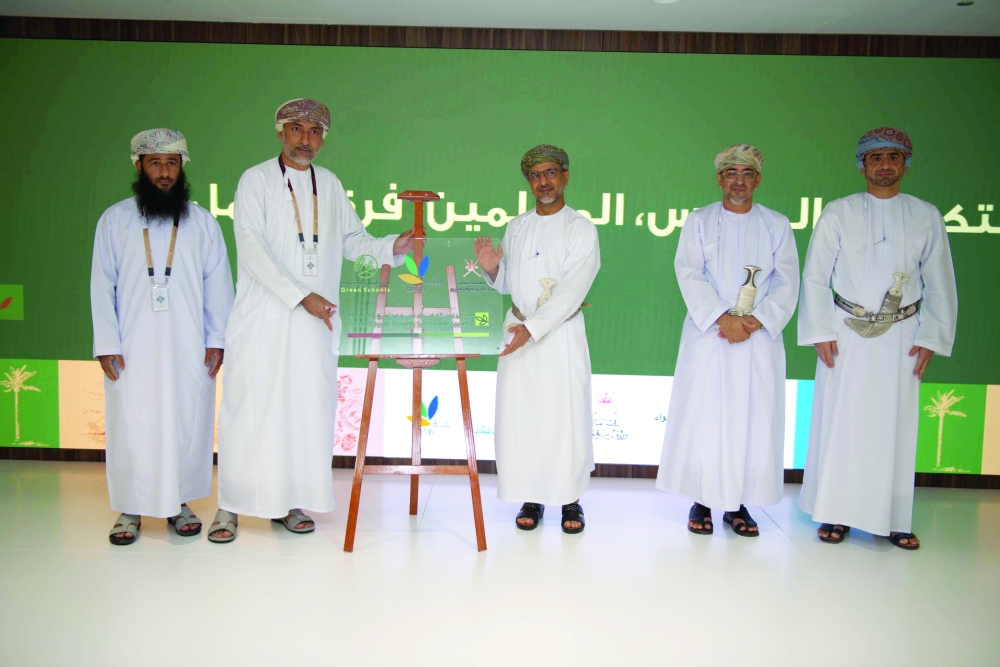 Dr Abdullah Ambusaidi, Under-Secretary of the Ministry of Education for Education, with company officials in Muscat on Monday