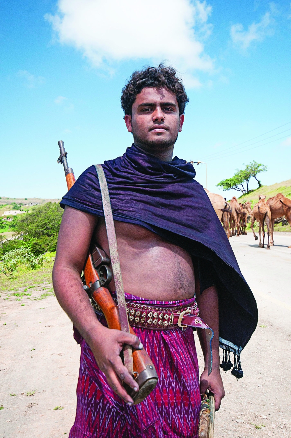 A camel herder with the traditional dress or Al Sabeegah