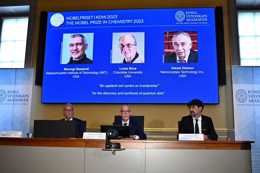 Hans Ellegren (centre), Permanent Secretary of the Royal Swedish Academy of Sciences, announces the winners of the 2023 Nobel Prize in Chemistry during a press conference at the Royal Swedish Academy of Sciences in Stockholm, Sweden, October 4, 2023. 