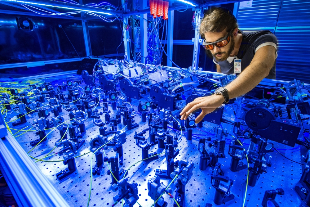 An undated photo provided by Reidar Hahn for the U.S. Department of Energy shows Paolo Girotti, a scientist at Fermilab, which had the world’s most powerful particle collider until the Large Hadron Collider was built, as he adjusts instruments for the Muon g-2 experiment in 2017. (Reidar Hahn/U.S. Department of Energy via The New York Times)