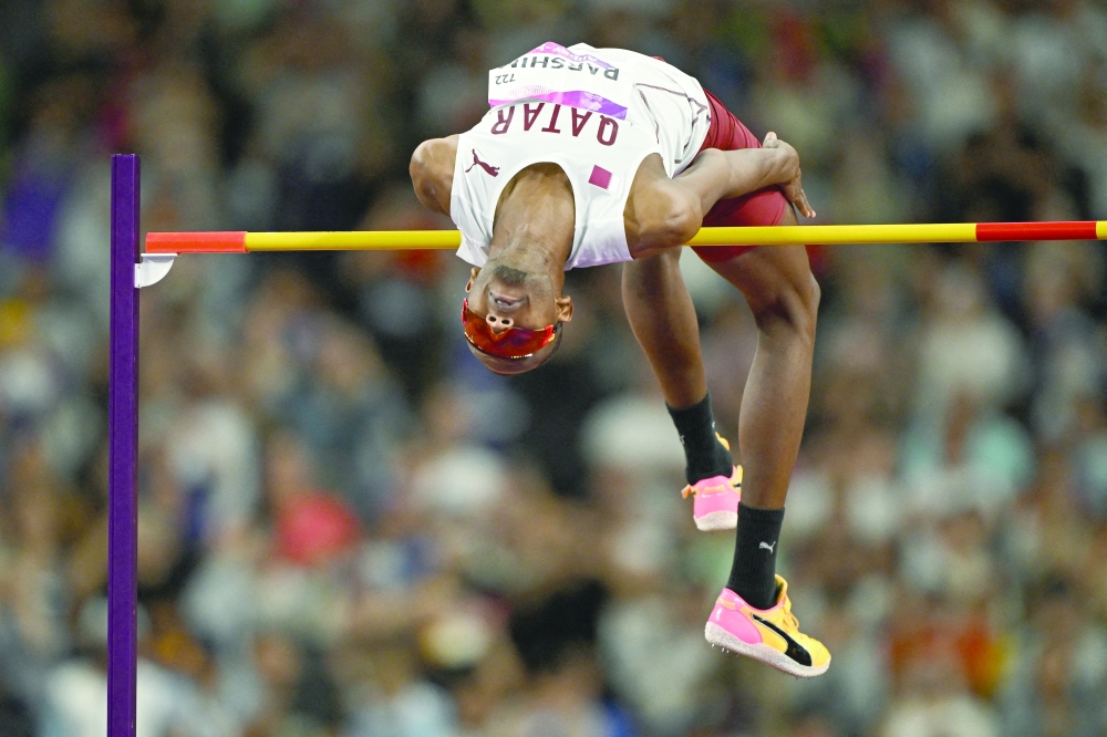 Qatar's Barshim M in action during the men's high jump final. -- Reuters