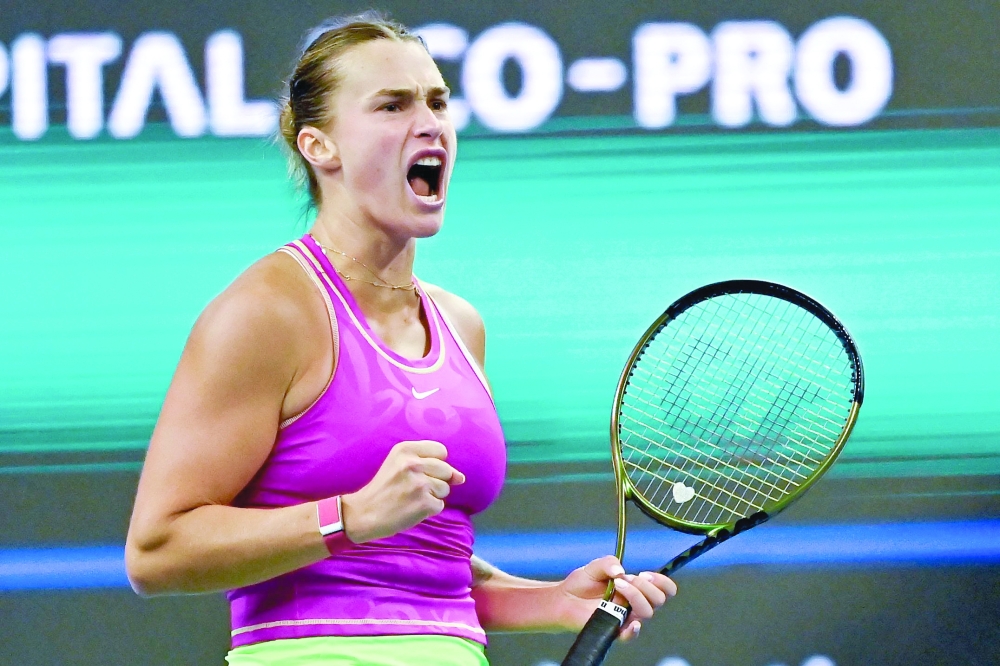 Belarus's Aryna Sabalenka reacts during her women's singles match against Italy's Jasmine Paolini of the WTA China Open tennis tournament in Beijing on October 5, 2023.