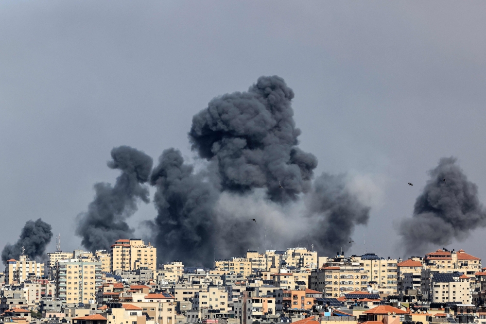 Smoke rises over Gaza City on October 7, 2023 
