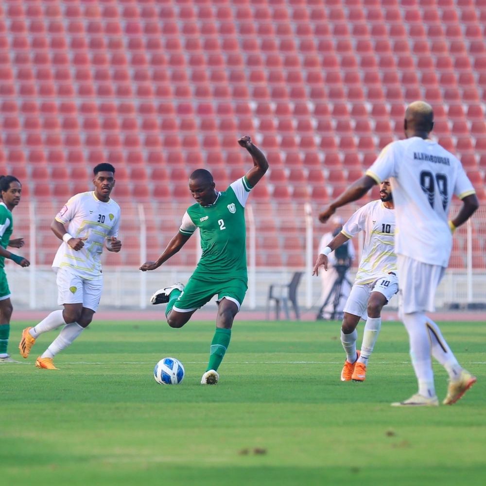 Al Ittihad club player shoots the ball