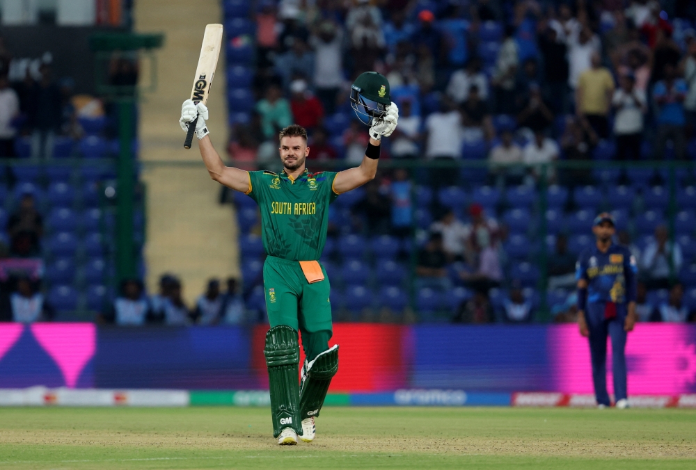  South Africa's Aiden Markram celebrates after reaching his century, the fastest ODI World Cup hundred, off just 49 balls REUTERS/Anushree Fadnavis