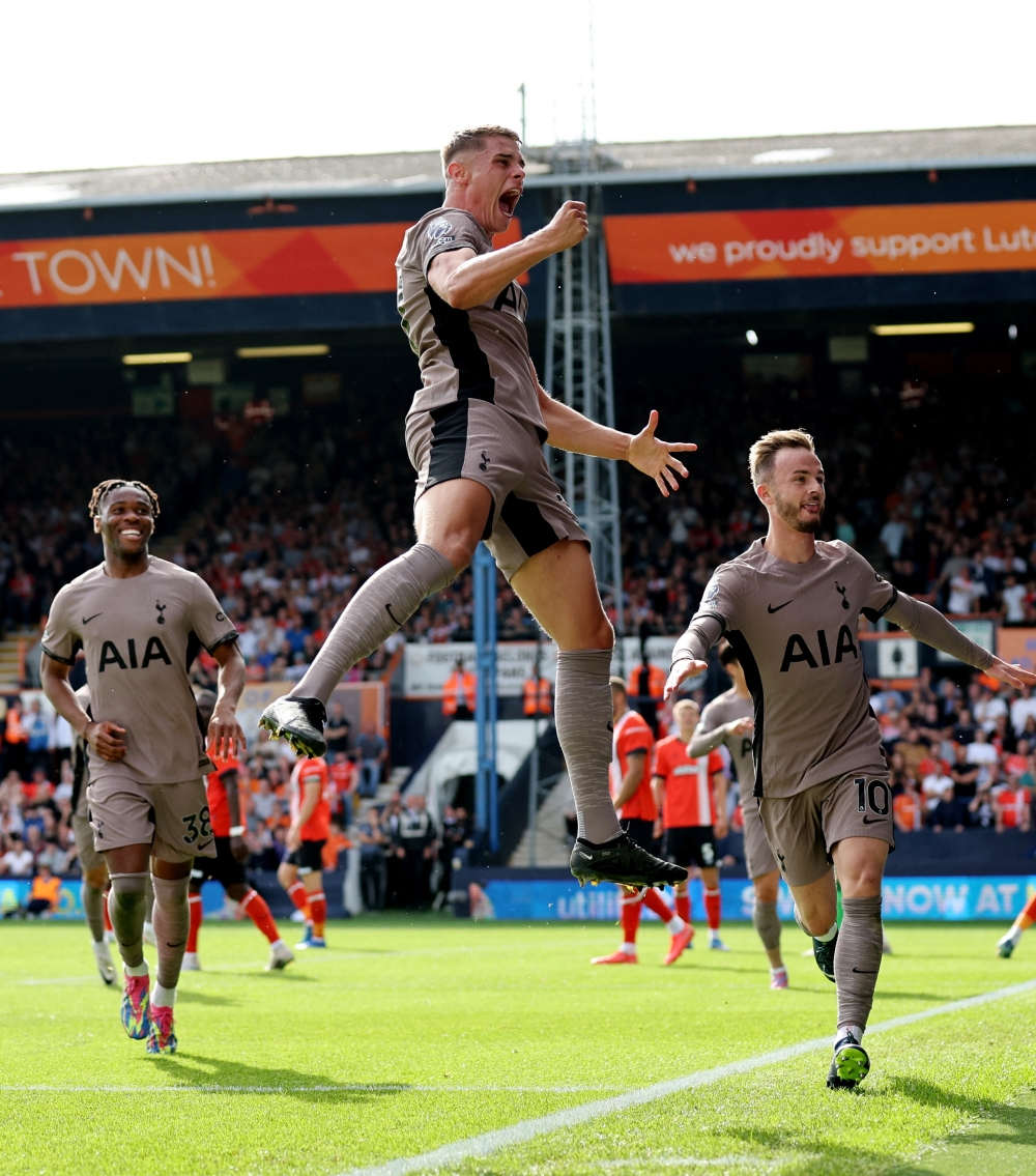 Micky van de Ven celebrates scoring their first goal with James Maddison and Destiny Udogie.—Reuters
