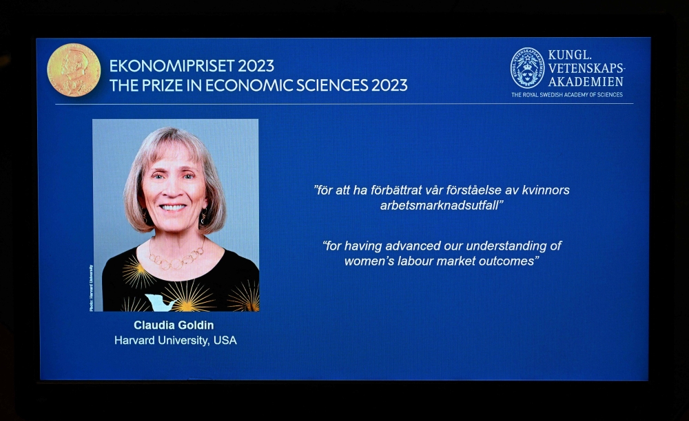 The winner of the 2023 Prize in Economic Sciences in Memory of Alfred Nobel American economist Claudia Goldin is seen on a display