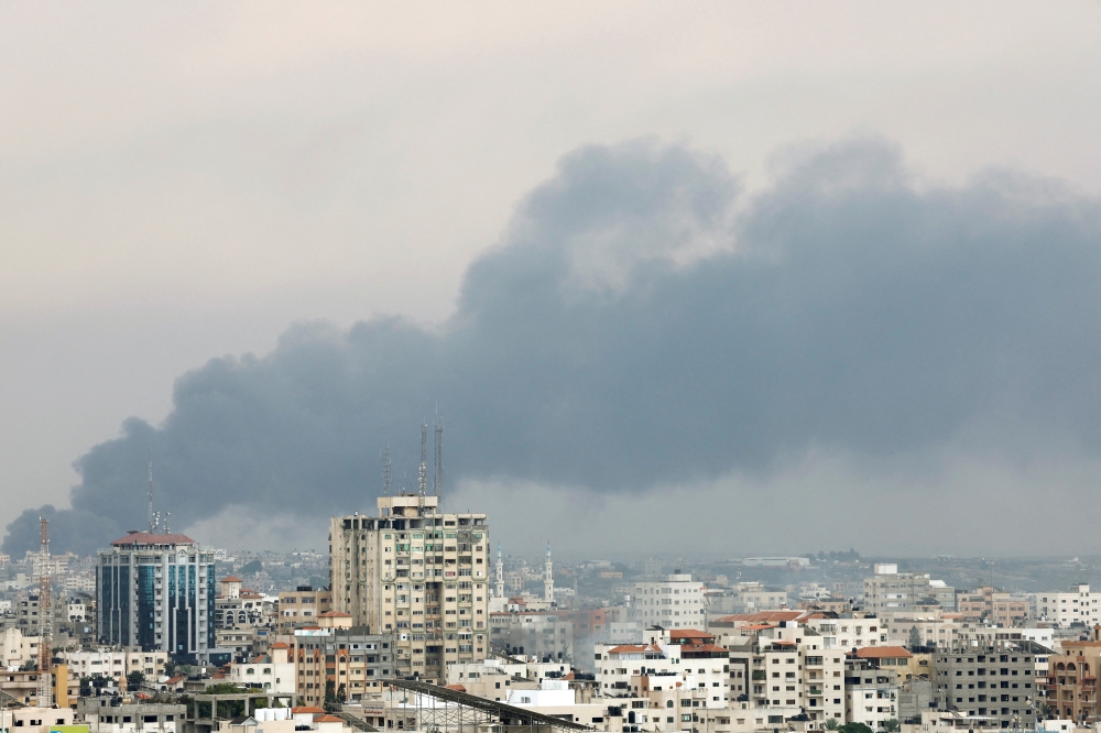 Smoke rises following Israeli strikes in Gaza, October 9, 2023. 