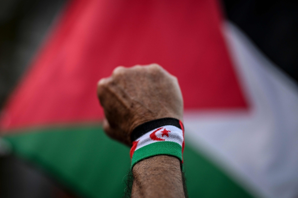 A protestor lifts his fist during a rally in support of Palestinians at Camoes square in Lisbon on October 9