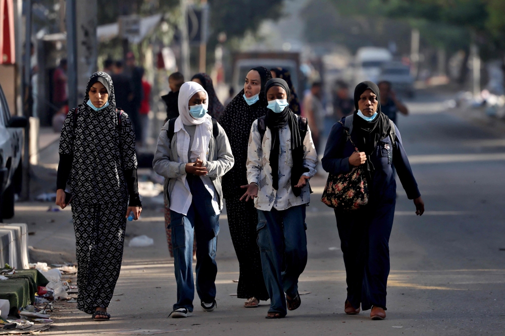 Palestinians flee to safer areas in Gaza City after Israeli air strikes