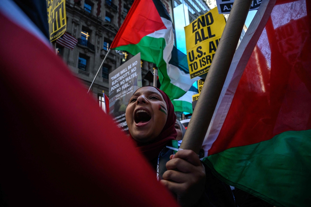 People demonstrate in support of Palestinians in New York City on October 13, 2023. 
