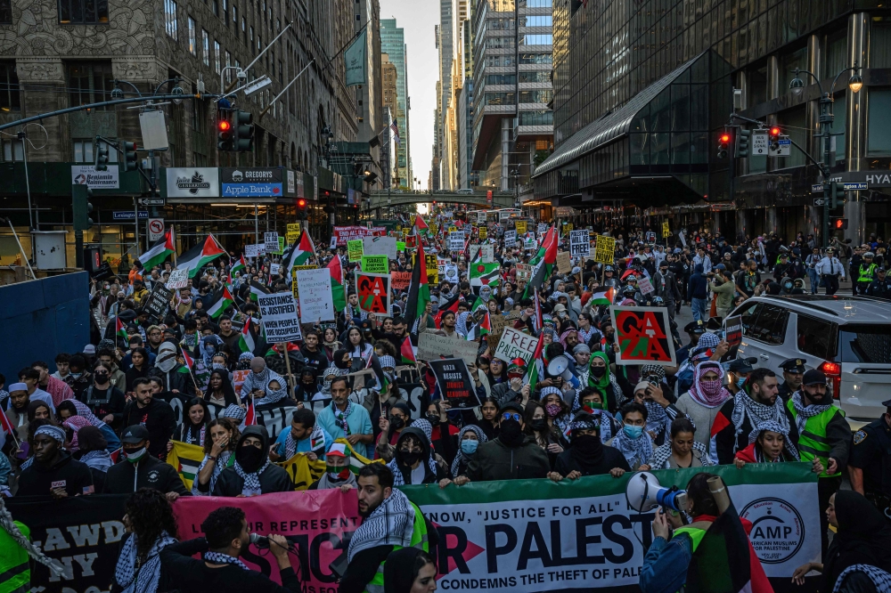 People demonstrate in support of Palestinians in New York City on October 13, 2023. 