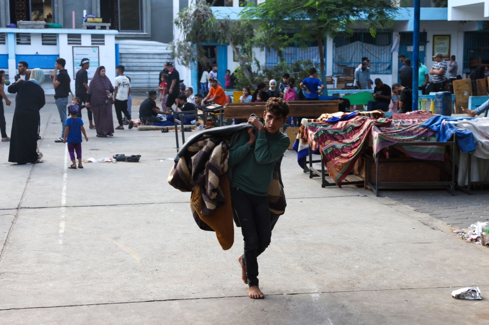 Palestinians take refuge in a United Nations school, in the Rafah refugee camp, in the southern Gaza Strip 