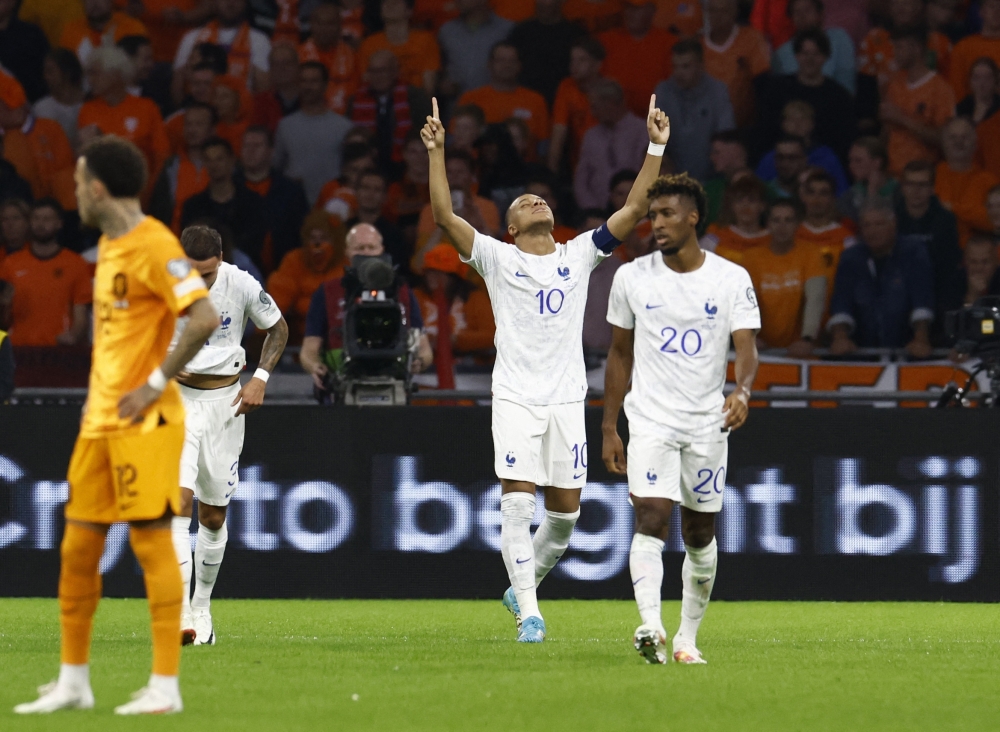 France's Kylian Mbappe celebrates scoring their second goal.— Reuters