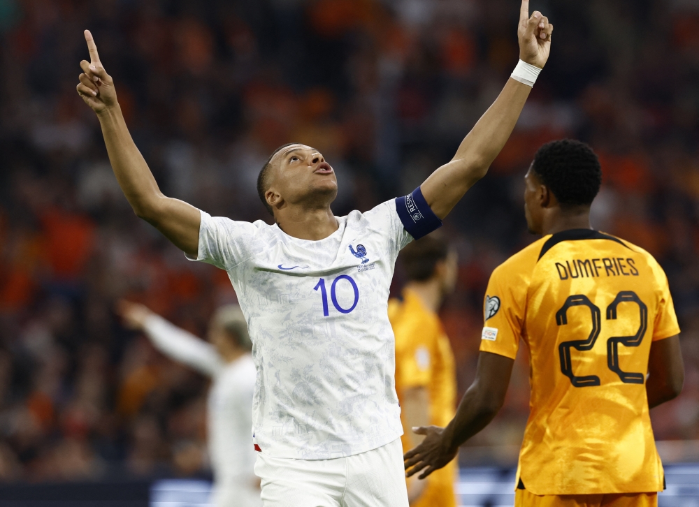 France's Kylian Mbappe celebrates scoring their first goal.—Reuters