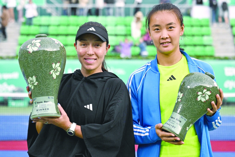 USA's Jessica Pegula (L) celebrates with her winner's trophy next to runner-up China's Yuan Yue. following their women's.—AFP

