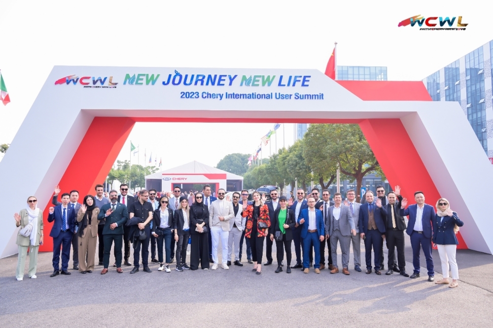 Delegates pose for a photo during the opening ceremony of the 2023 Chery International User Summit in Wuhu, China
