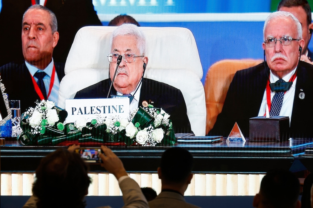 Palestinian President Mahmud Abbas attending the International Peace Summit hosted by the Egyptian president in Cairo 