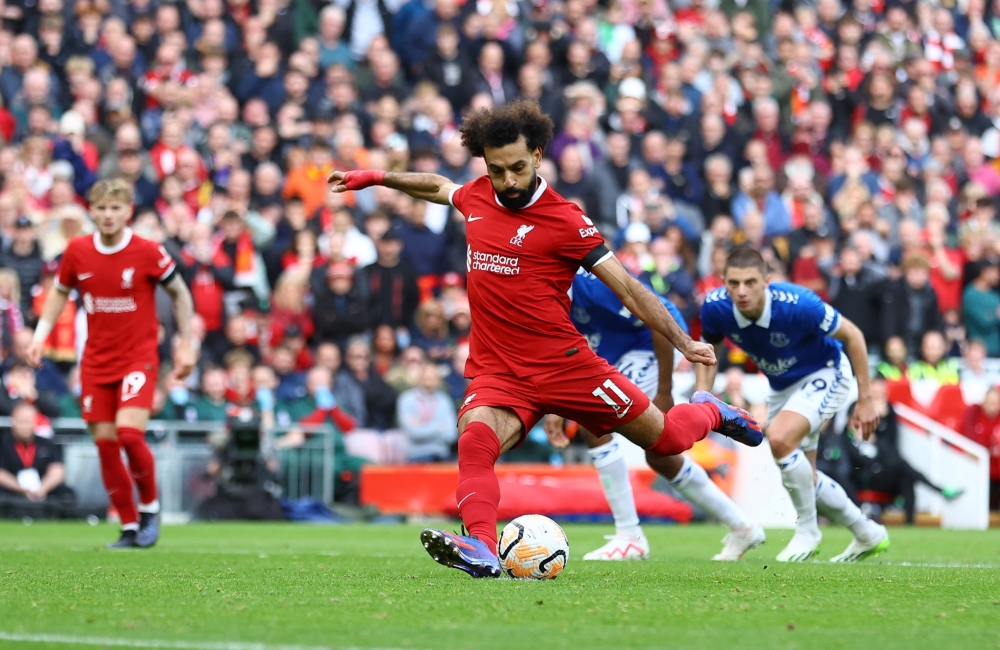 Mohamed Salah scores their first goal from the penalty spot.—Reuters