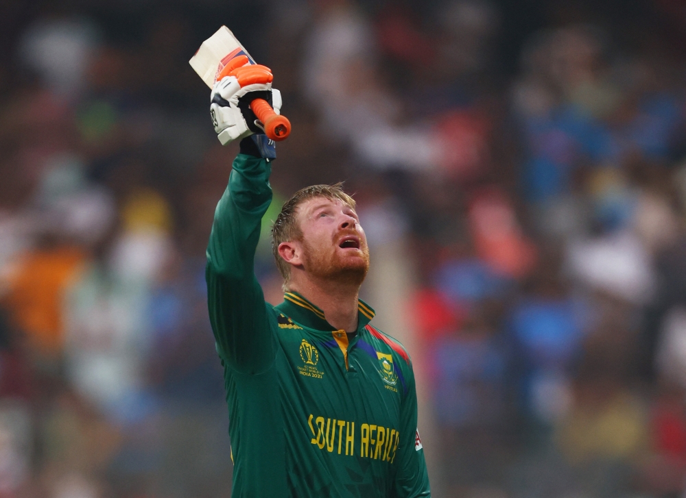 Africa's Heinrich Klaasen celebrates after reaching his century.—Reuters