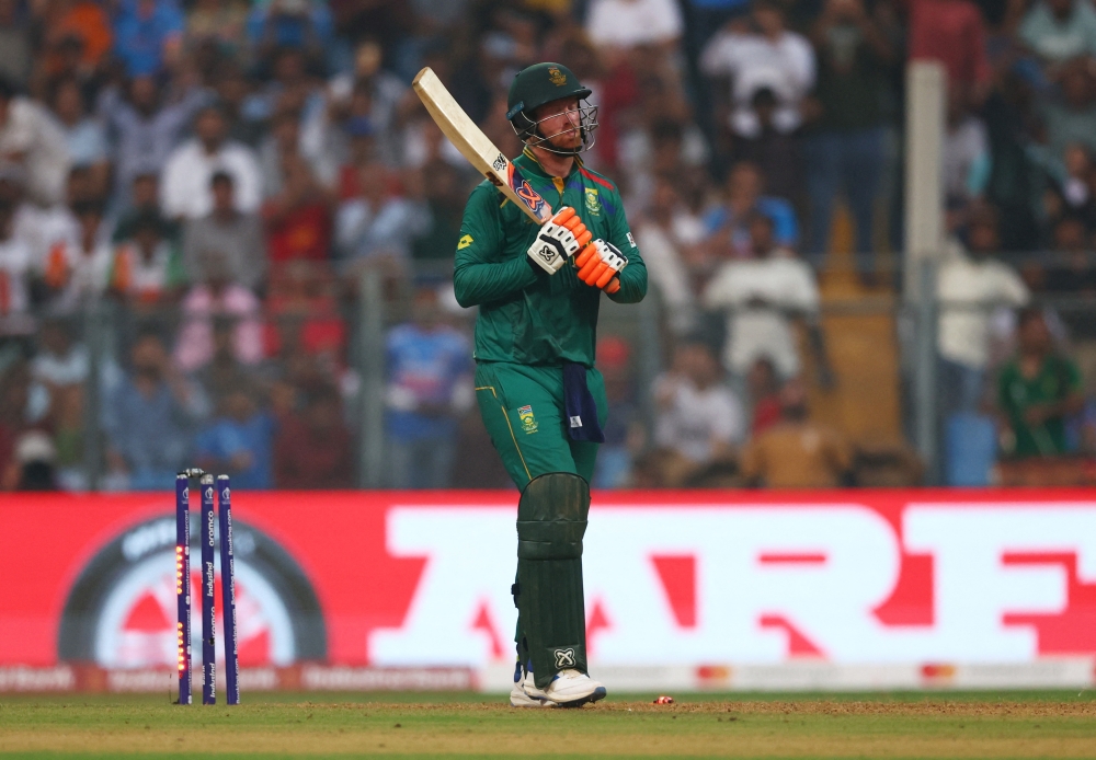 Africa's Heinrich Klaasen celebrates after reaching his century.—Reuters