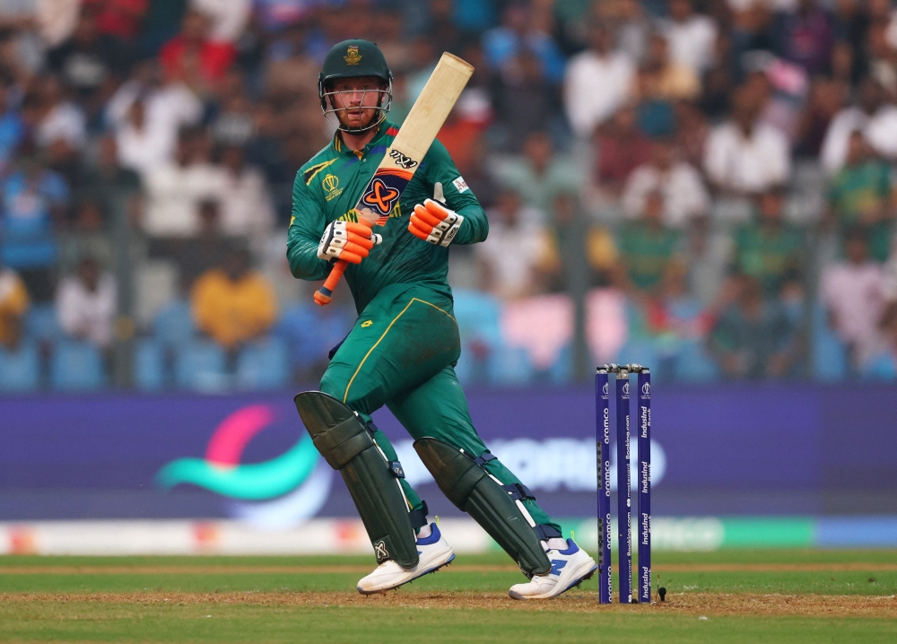 Africa's Heinrich Klaasen celebrates after reaching his century.—Reuters