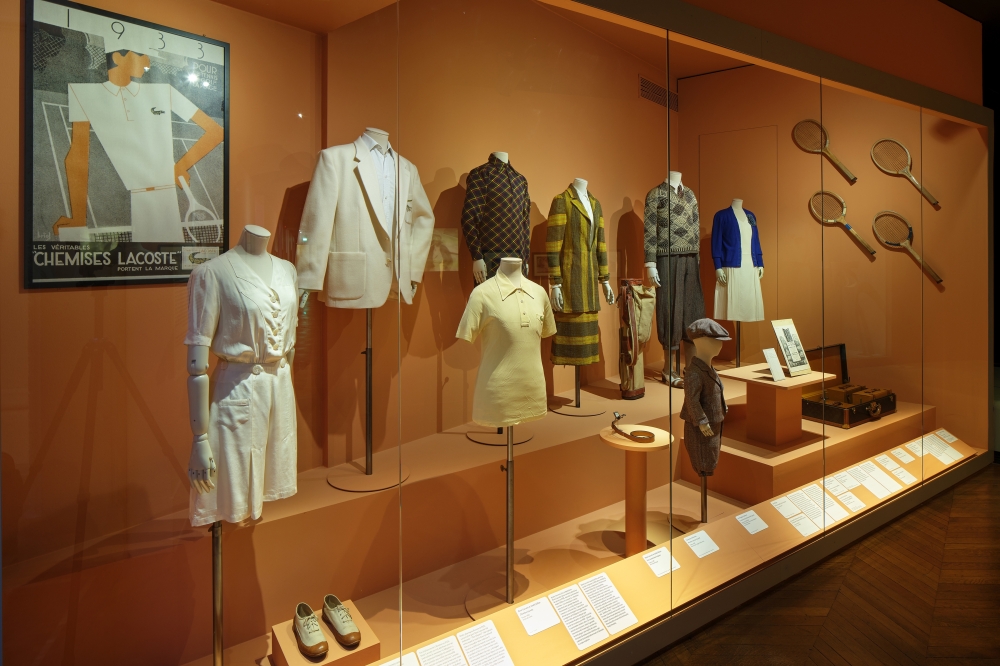 A display of outfits created especially for participating in sports includes tennis designs by Ren