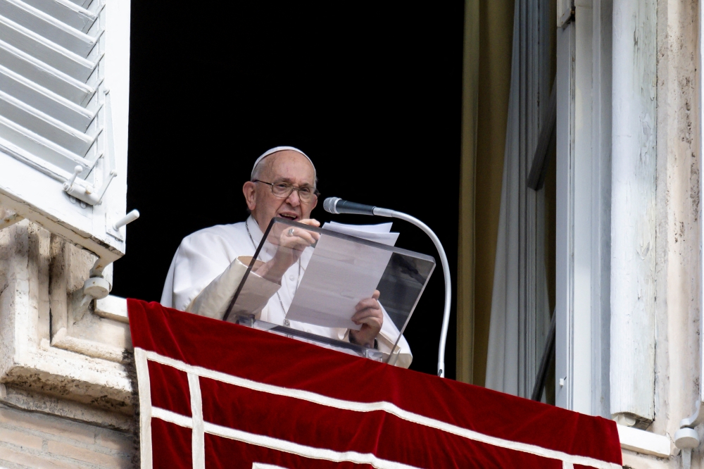Pope Francis leads the Angelus prayer from his window at the Vatican. — Reuters 