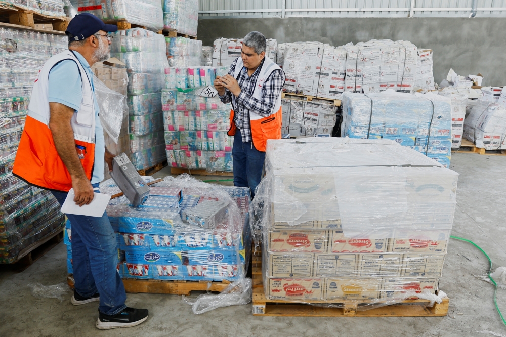 The United Nations says at least 100 trucks a day are needed to provide the basic needs of Gaza's 2.4 million inhabitants 
