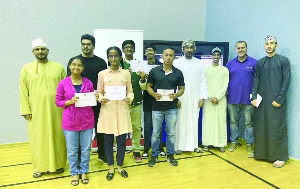 Winners of the chess tournament with the officials.