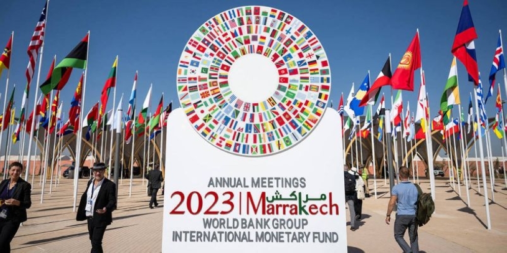 People are seen outside the main entrance to the venue of the International Monetary Fund and World Bank meetings in Marrakech, Morocco. — Reuters