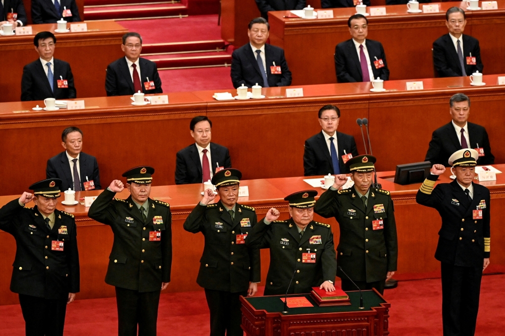 Zhang Youxia (front), swears an oath with members of the Central Military Commission during the fourth plenary session of the National People's Congress (NPC) at the Great Hall of the People in Beijing. — Reuters file photo