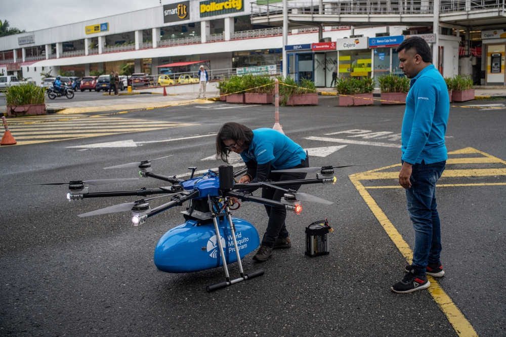 A World Mosquito Program drone, which spits out 150 disease-neutralizing mosquitoes every 50 meters, skimming over rooftops and between high-rises, in Cali, Colombia, Jan. 18, 2023. (Federico Rios/The New York Times)
