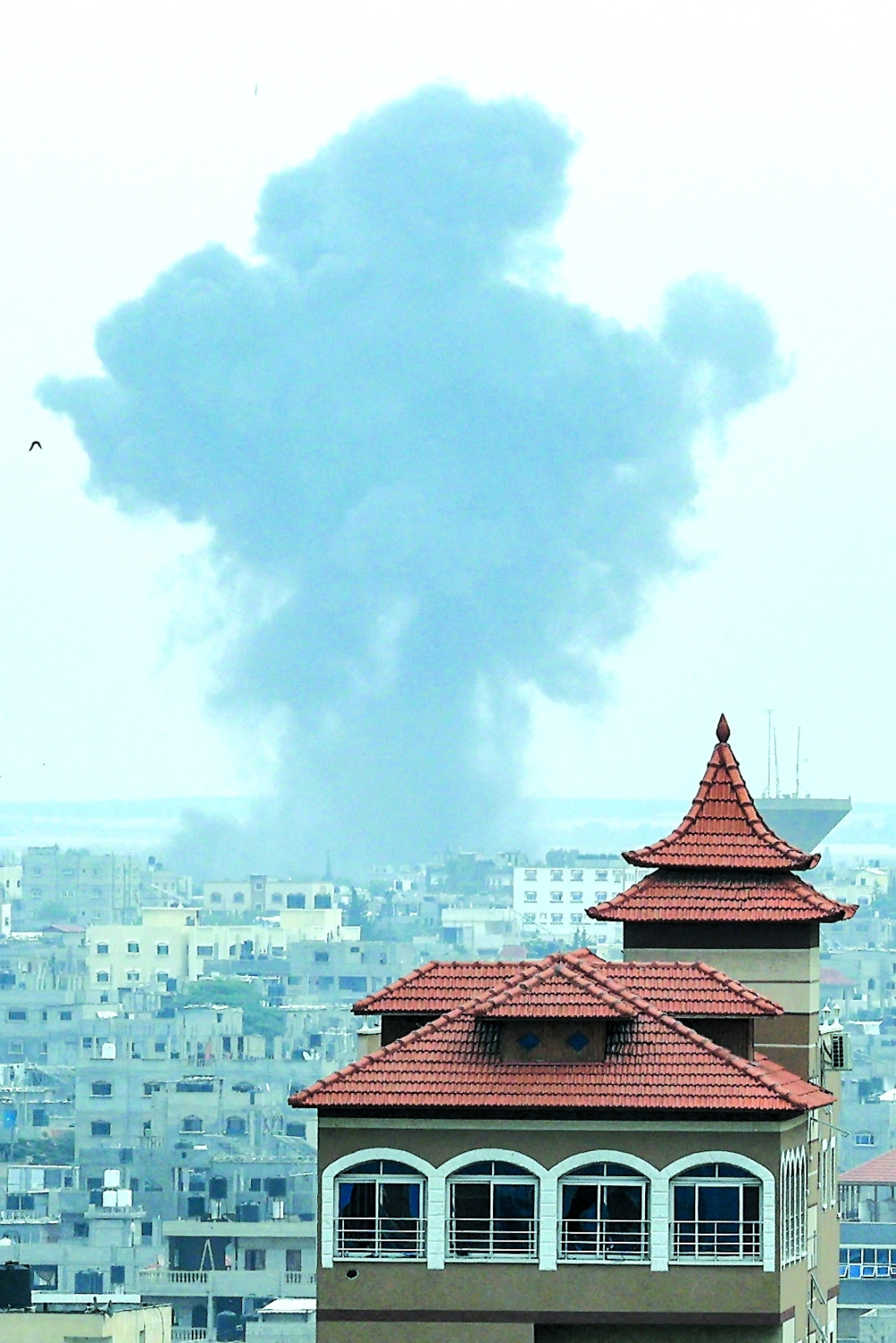 
Smoke rises above buildings during an Israeli strike in Rafah in the southern Gaza Strip amid ongoing battles between Israel and Hamas. - AFP
