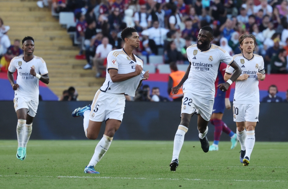  Real Madrid's Jude Bellingham celebrates scoring their first goal with Antonio Rudiger.—Reuters
