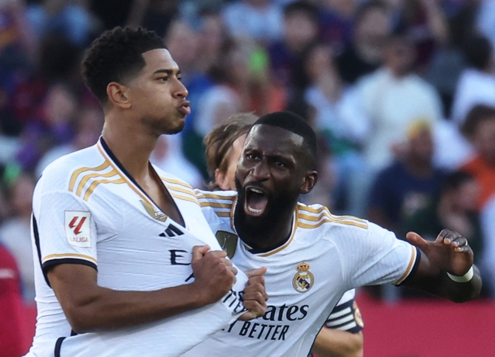 Real Madrid's Jude Bellingham celebrates scoring their first goal with Antonio Rudiger.—Reuters

