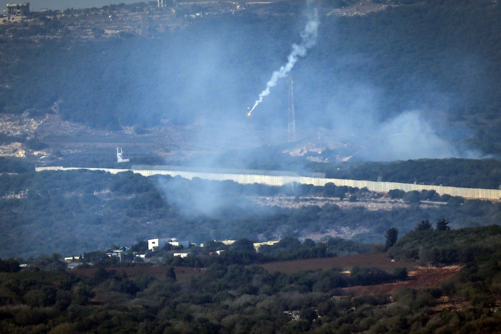 Flares are fired from northern Israel over the southern Lebanese border village of Aita al-Shaab. — AFP 